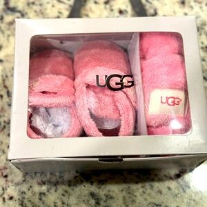 Ugg baby slippers and lovey.